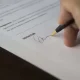 residuary clause, image of hand signing a document