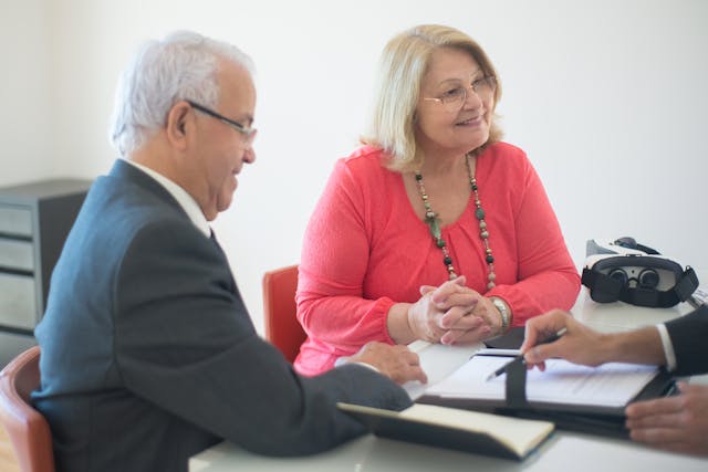 Avoid Estate Taxes, image of couple in an office meeting
