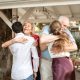 long-term inheritance distributions, image of grandparents hugging young adult grandchildren