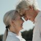 intentional estate planning, image of senior couple standing forehead to forehead smiling