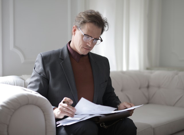 estate administration, image of businessman looking at documents