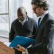 avoid guardianship, image of businessman showing a folder to a client