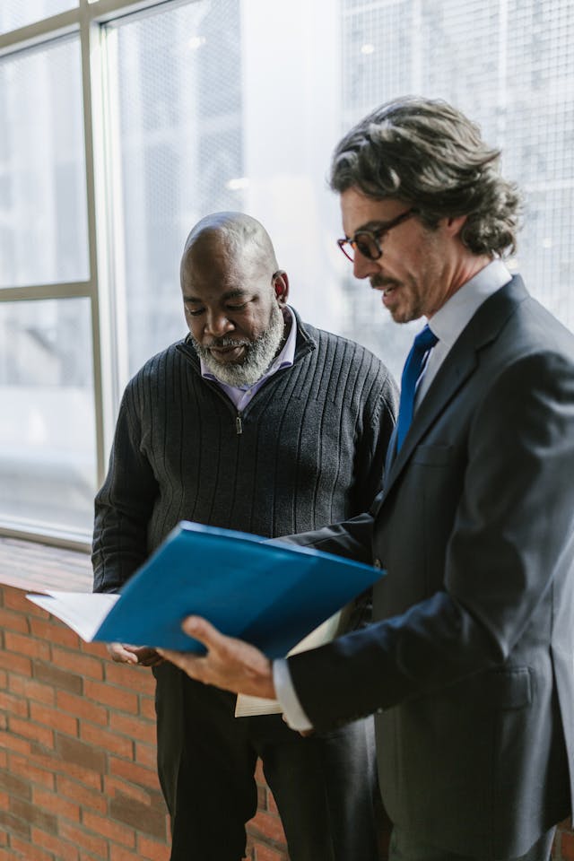avoid guardianship, image of businessman showing a folder to a client