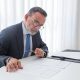Is There a Simplified Probate Process in CT, image a main in a suit working at a desk