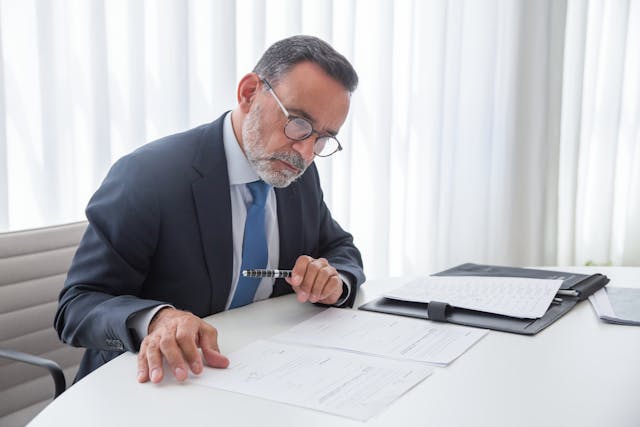 Is There a Simplified Probate Process in CT, image a main in a suit working at a desk