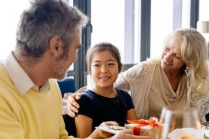 10 Costly Estate Planning Mistakes, image of middle aged couple with a child